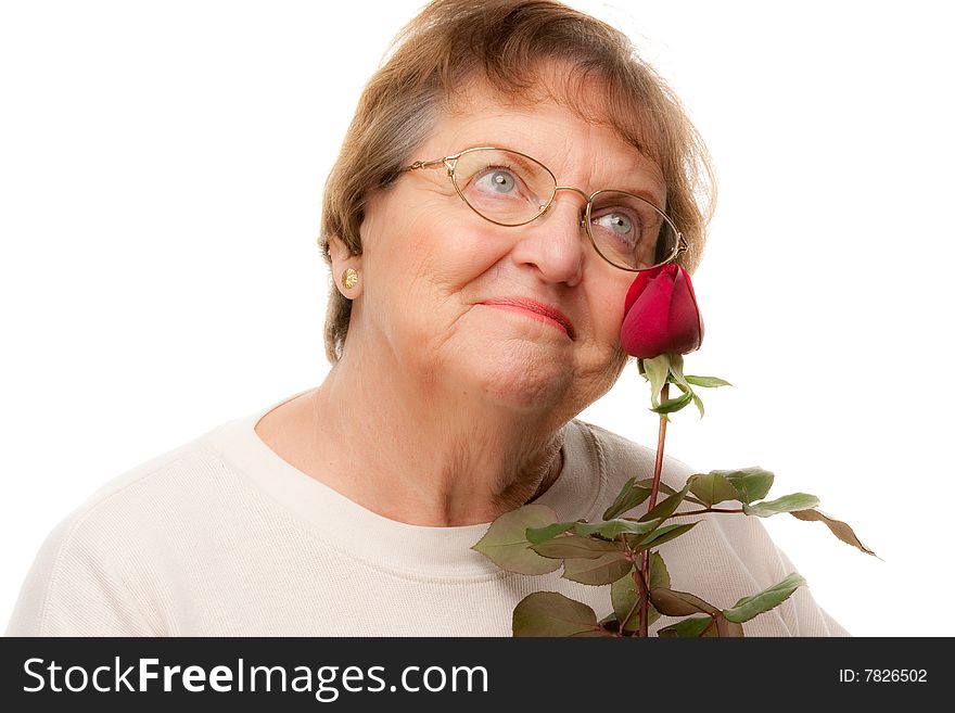 Attractive Senior Woman With Red Rose
