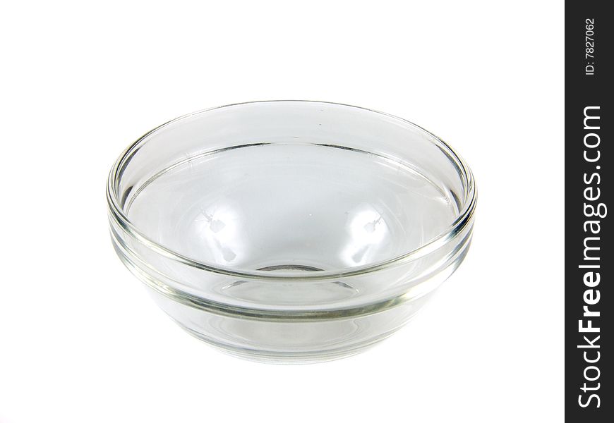 Transparent, small, glass cup on white background