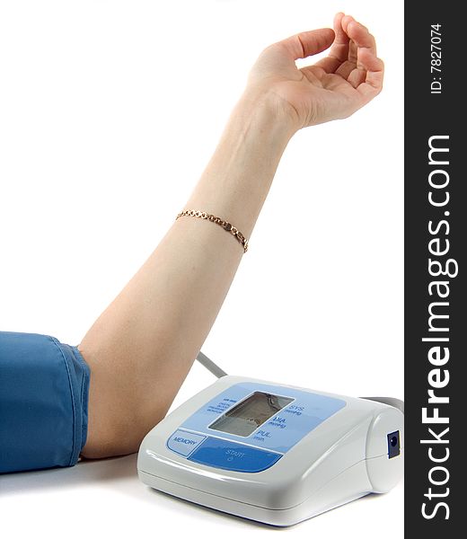 Feminine hand with instrument measuring pressure and pulse. Feminine hand with instrument measuring pressure and pulse