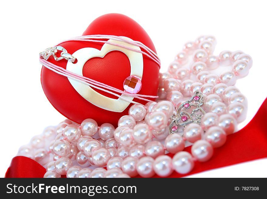 Valentine hearts,red ribbon,pink pearls and heart shape medallion on white background.