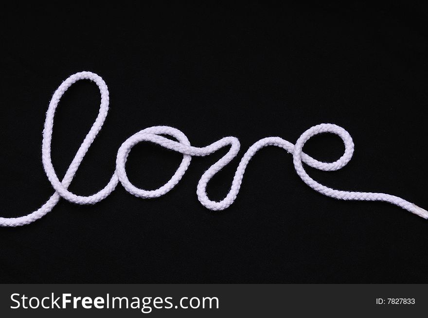 I love you by the rope over black background
