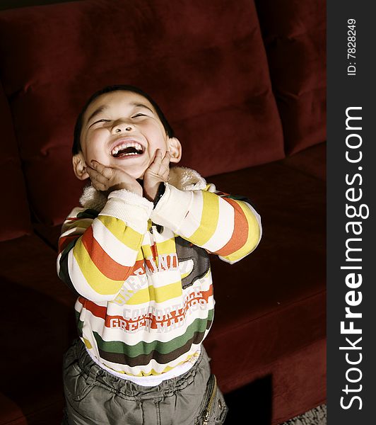 Boy laughing upward