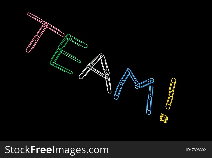Word Team made of paperclips on black background. Word Team made of paperclips on black background