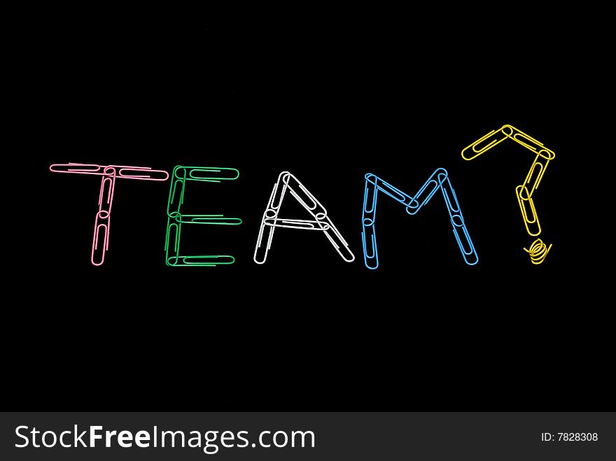 Word Team made of paperclips on black background. Word Team made of paperclips on black background