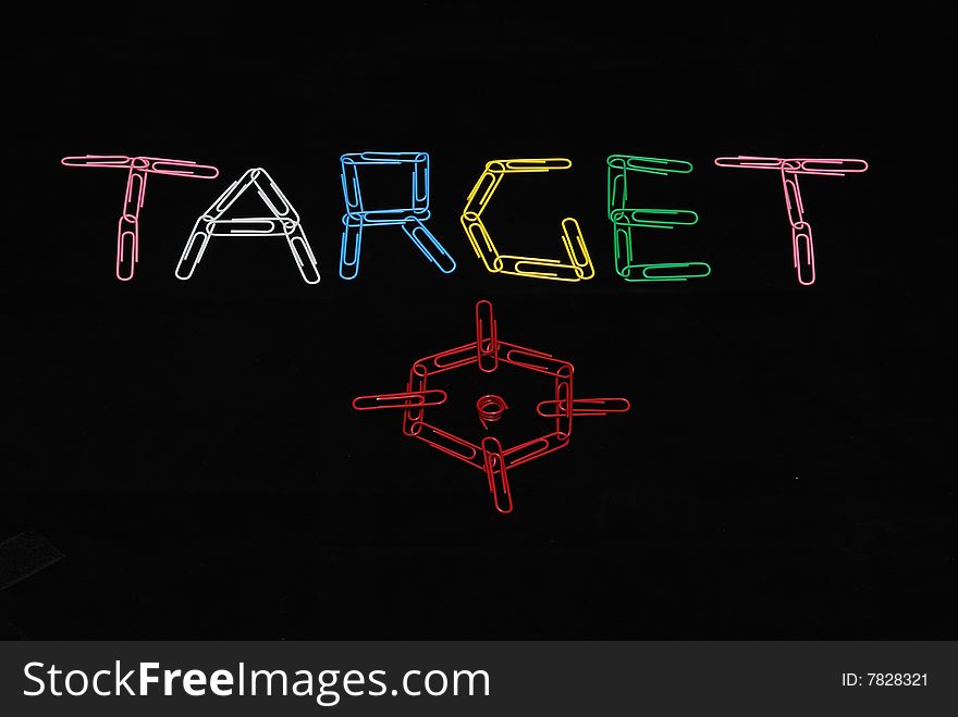 Word Target made from paperclips on black background