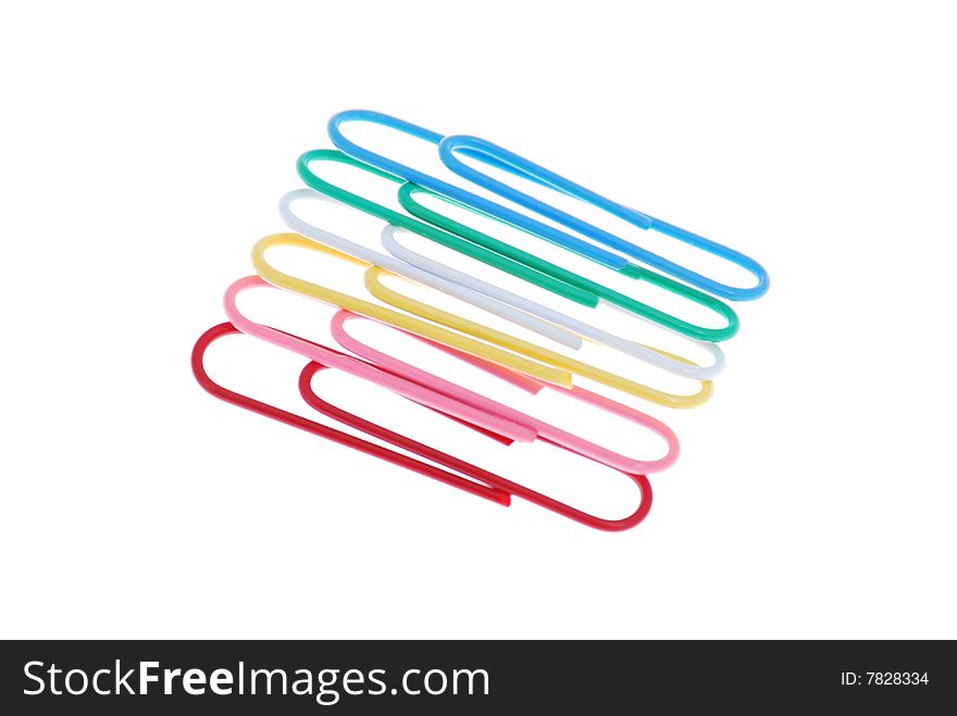 Few colored paper clip on white background close