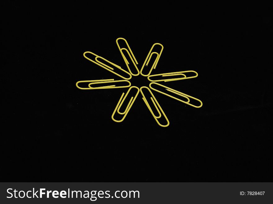 Paperclips sun on black background. Paperclips sun on black background