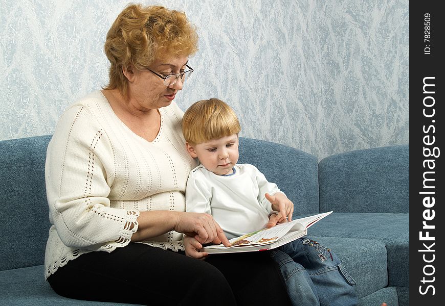 Portrait of the grandmother with the grandson in house conditions