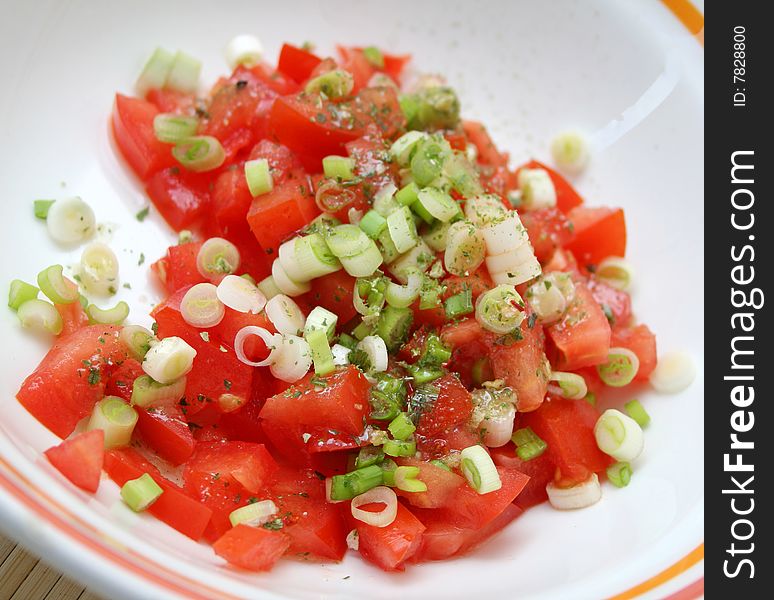 Fresh salad of tomatoes with spring onions