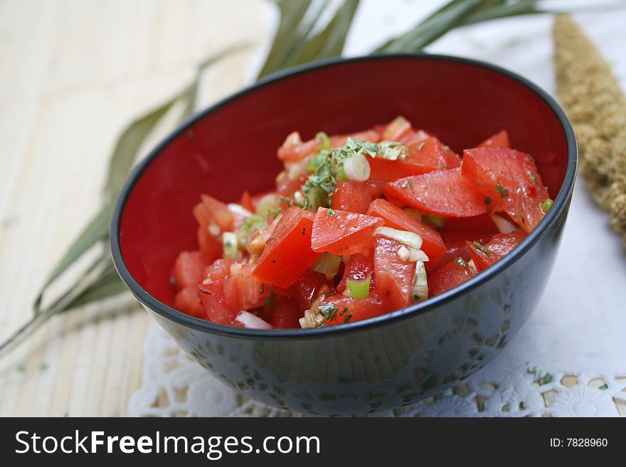 A fresh salad of tomatoes with onions and spices