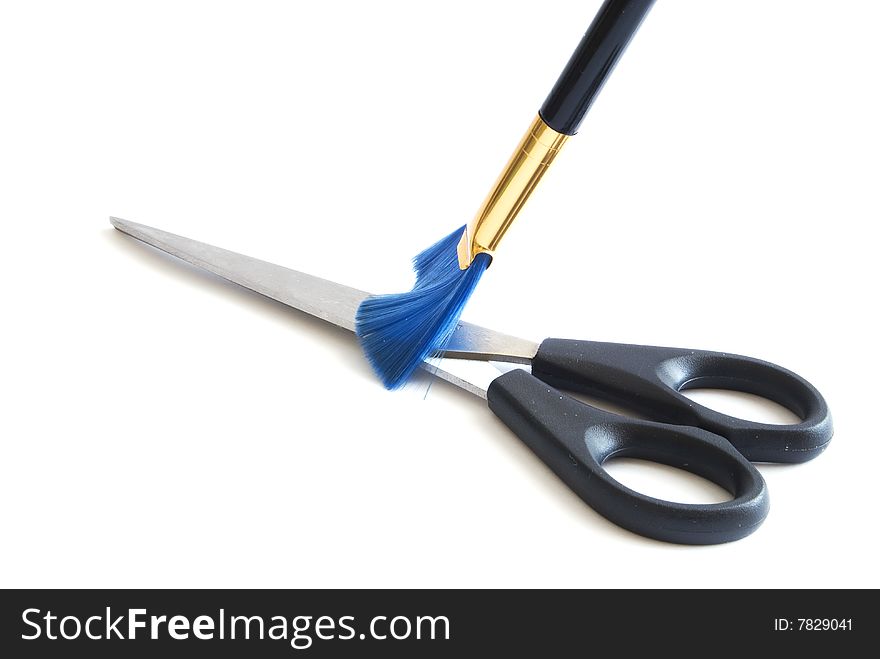 The brush clearing scissors from a dust. The brush clearing scissors from a dust