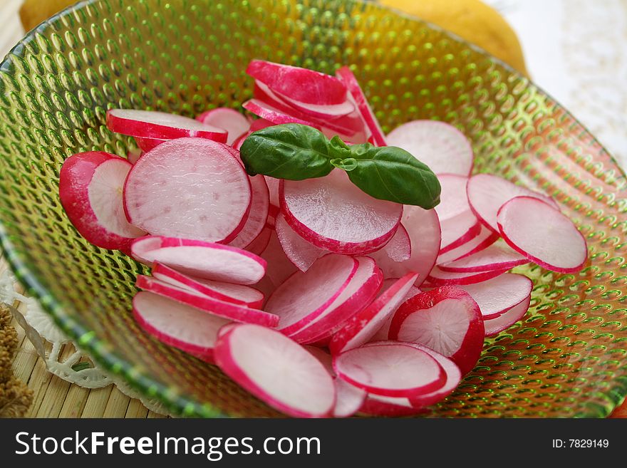 A fresh salad of red radish with basil