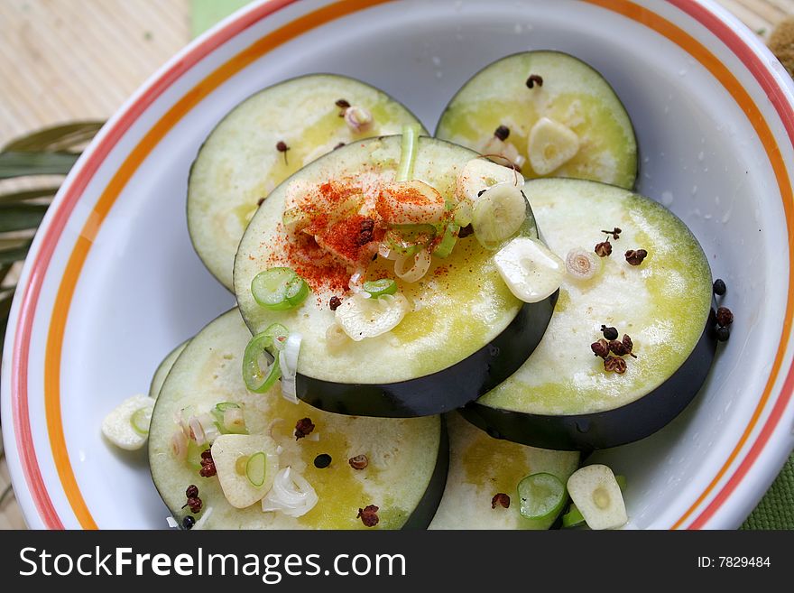 Some fresh aubergines with garlic and pepper