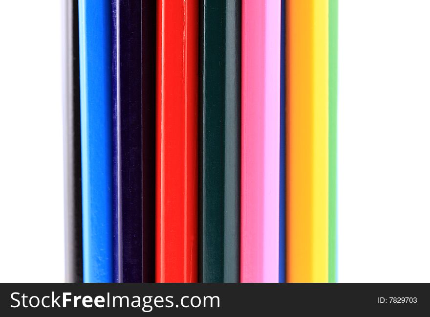Many coloured pencils together in a vertical view. Many coloured pencils together in a vertical view