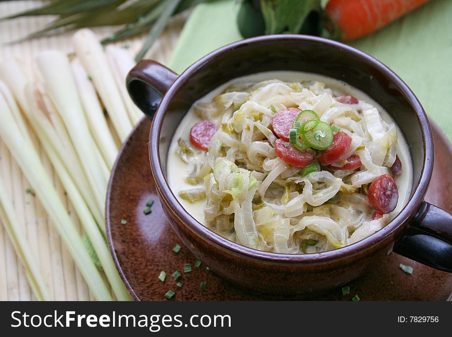 A fresh stew of endive with some sausage