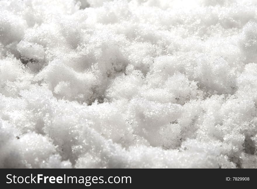 Background of white snow. close up