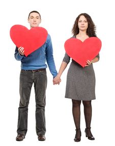 Couple Holding Two Red Hearts Stock Photo Couple Holding Two Red Hearts Stock Photo