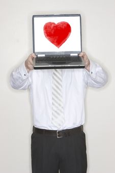 Businessman Holding Laptop With Heart Stock Photo Businessman Holding Laptop With Heart Stock Photo