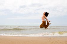 Happy Woman Is Jumping In Beach Royalty Free Stock Images