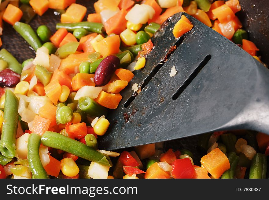 Fried vegetables on the skillet. Hot and fresh. Narrow depth of field. Fried vegetables on the skillet. Hot and fresh. Narrow depth of field.