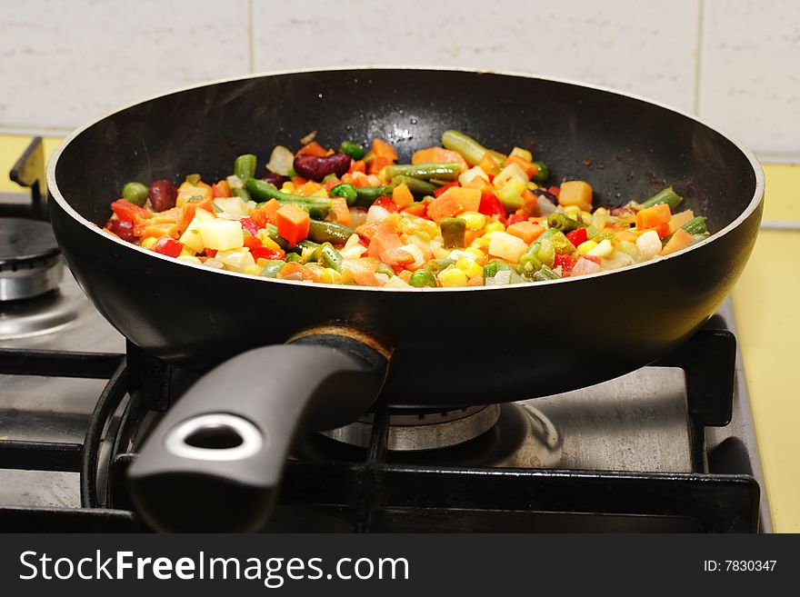 Fried vegetables on the skillet. Hot and fresh. Narrow depth of field. Fried vegetables on the skillet. Hot and fresh. Narrow depth of field.