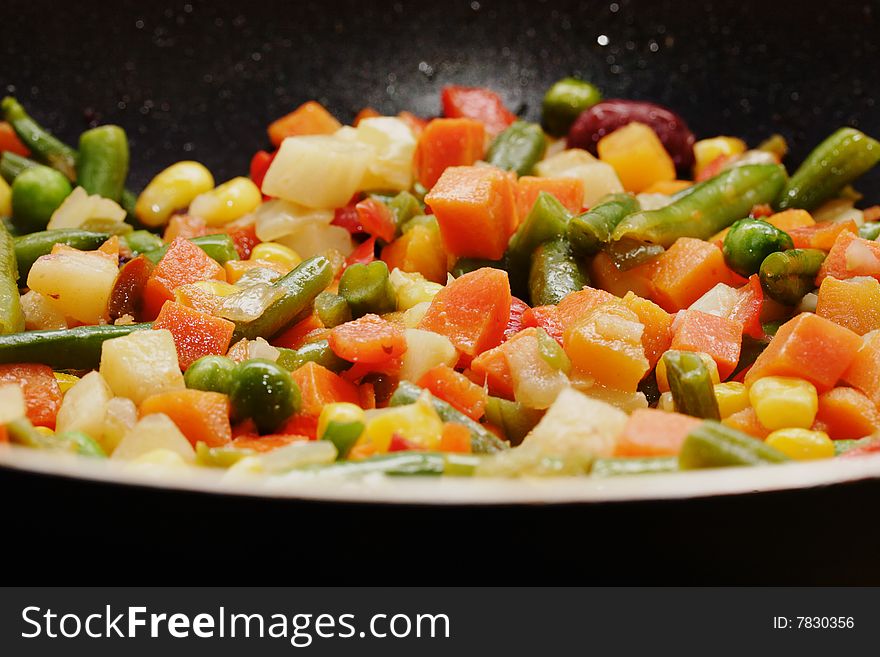 Fried vegetables on the skillet. Hot and fresh. Narrow depth of field. Fried vegetables on the skillet. Hot and fresh. Narrow depth of field.