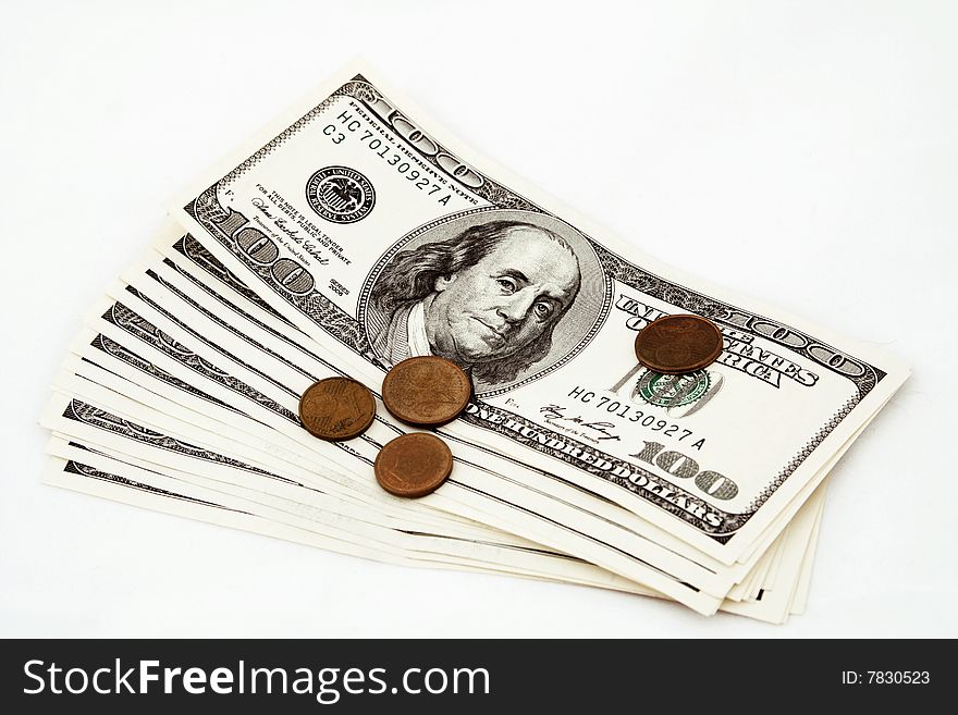 Photo hundred dollar bills and coins on white background