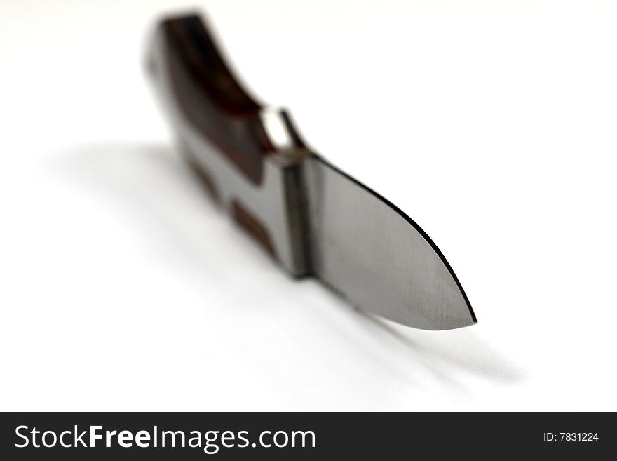Extreme macro shot of knife edge isolated on a white background. Extreme macro shot of knife edge isolated on a white background
