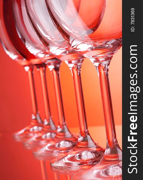 Wine glasses on red background