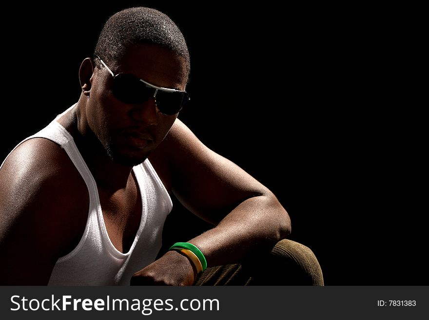 Young african american male on black background