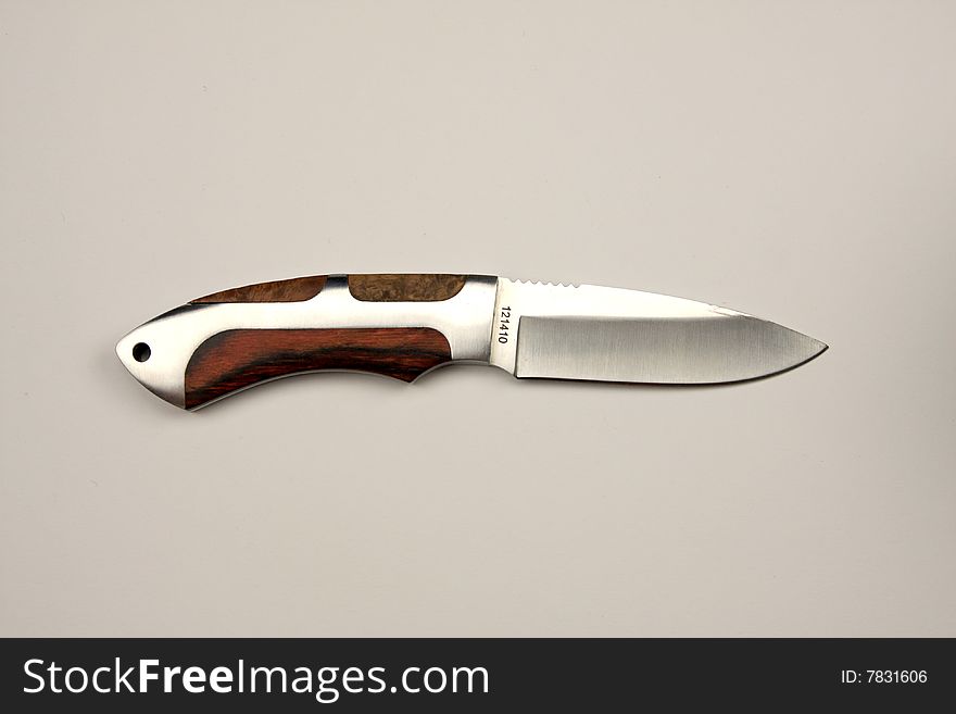 Hunting knife isolated on a gray background