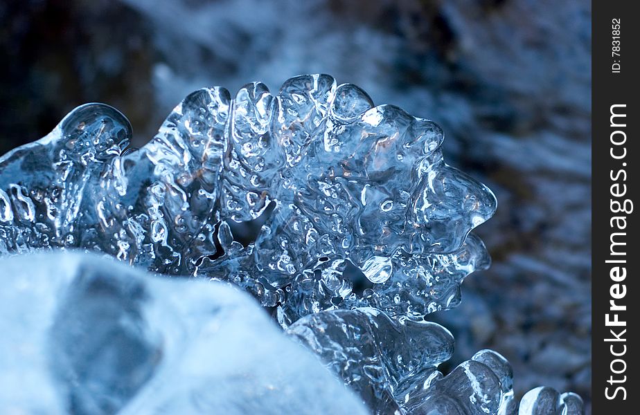 Ice figure on flowing river background. Ice figure on flowing river background