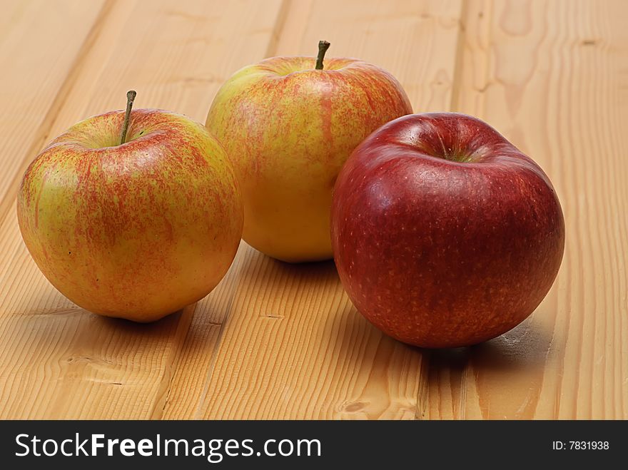 Apple On Wooden Plate