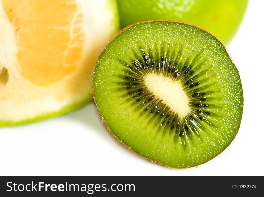 Juicy and fresh Kiwi fruit, macro,closeup inside and grapefruit in the back, isolated on white background. Juicy and fresh Kiwi fruit, macro,closeup inside and grapefruit in the back, isolated on white background