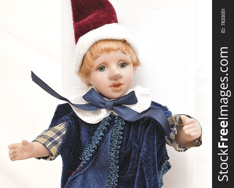 Detailed home made blonde hair porcelain Pinocchio with red hat and blue dress big topknot