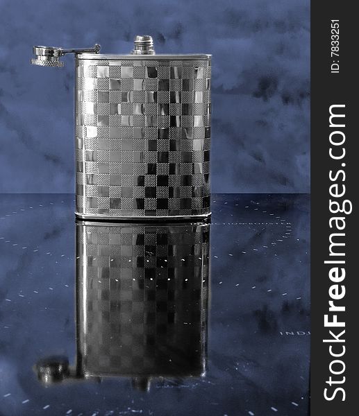 Open metallic flask with reflection. Open metallic flask with reflection