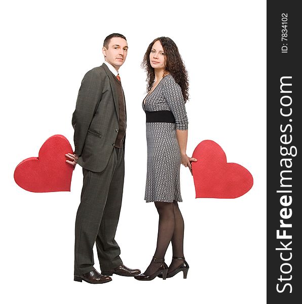 Loving couple holding red hearts isolated over white