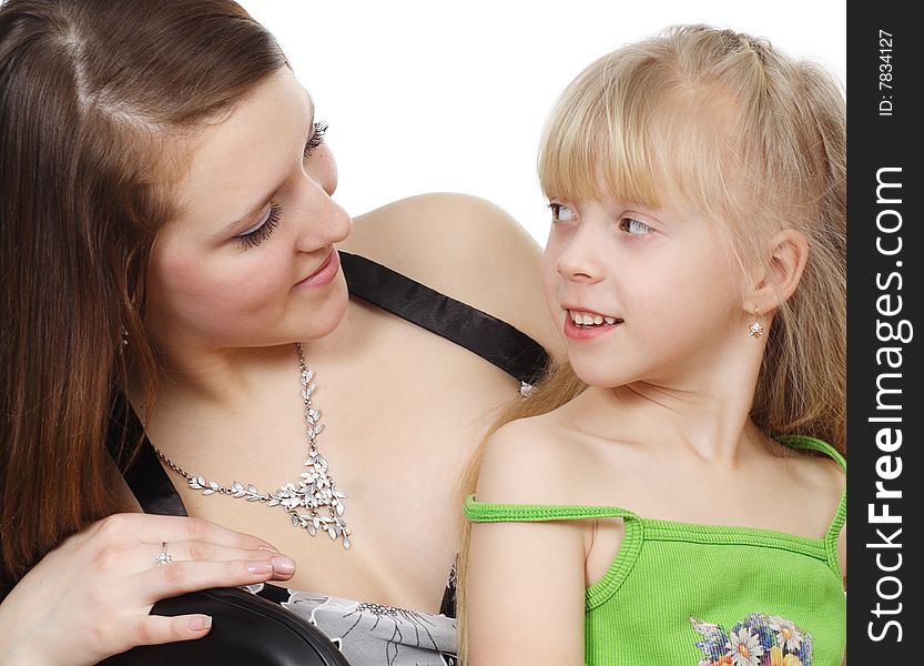 The young woman and  girl are isolated on a white background