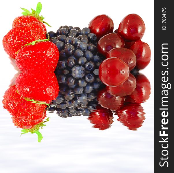 Fresh strawberries, bilberries and sweet cherry close up. Fresh strawberries, bilberries and sweet cherry close up