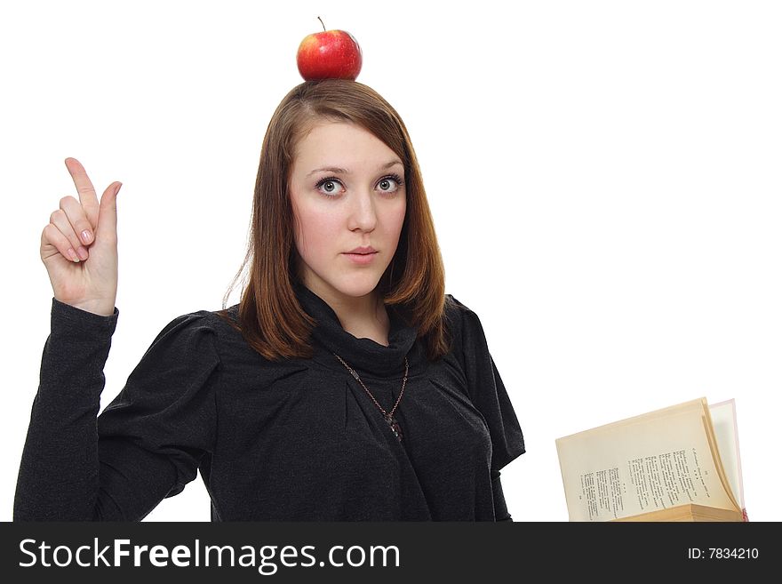 The girl with the book and a red apple on a white background. The girl with the book and a red apple on a white background