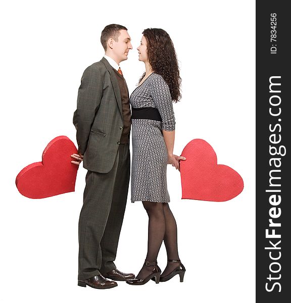 Couple holding red hearts isolated over white
