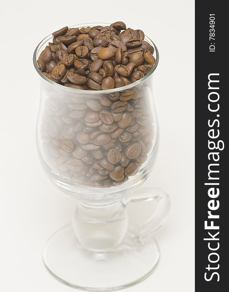 Seeds of coffee in high glass. Seeds of coffee in high glass