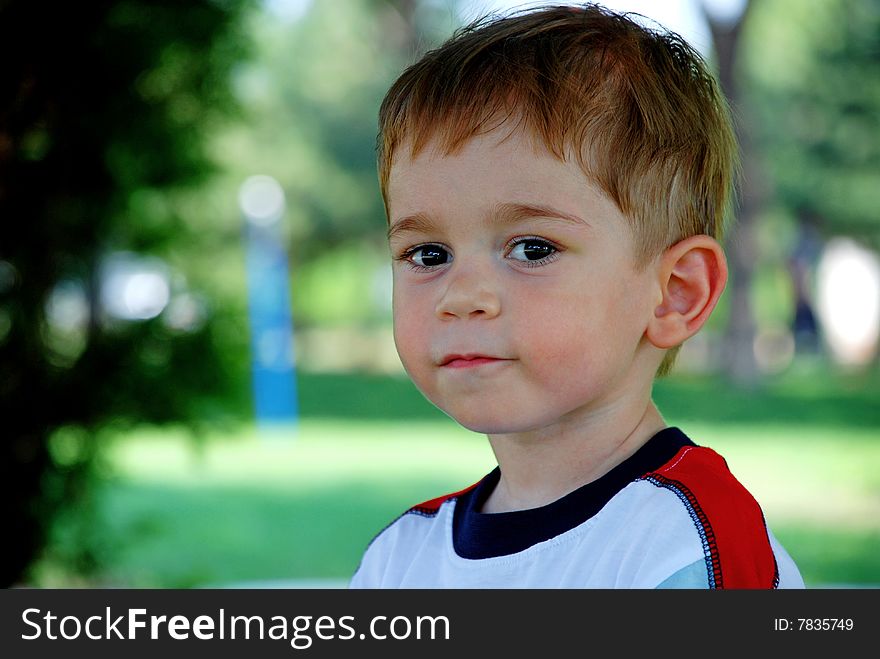 Photo of little boy looking at camera
