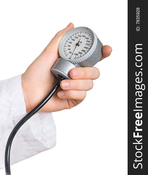 The scale of the instrument for measuring blood pressure in the hand of the doctor