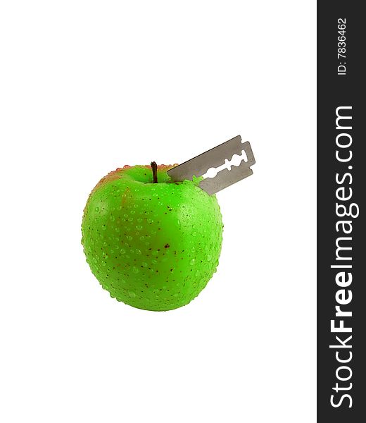 Razor in the green apple on white