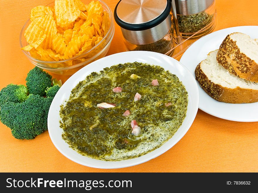 Gourmet Cream Soup With Green Cabbage And Slices Of Ham.