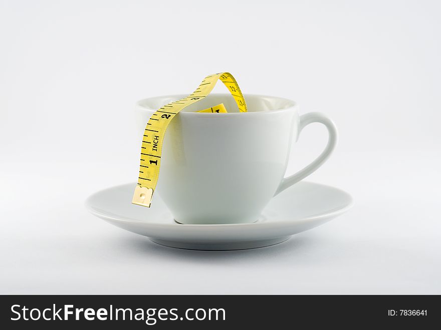 Coffee Cup with yellow tape measure