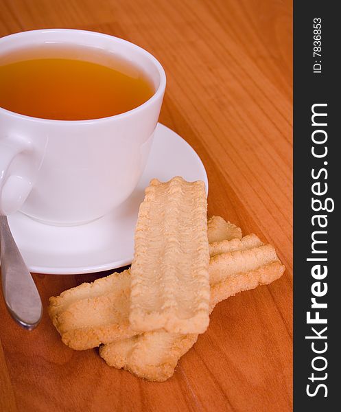 Cup of tea and some cookies on wooden table. Cup of tea and some cookies on wooden table