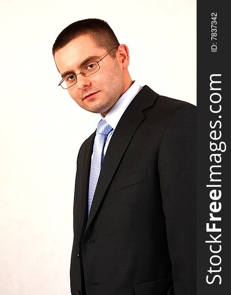 Young businessman on isolated background smiling