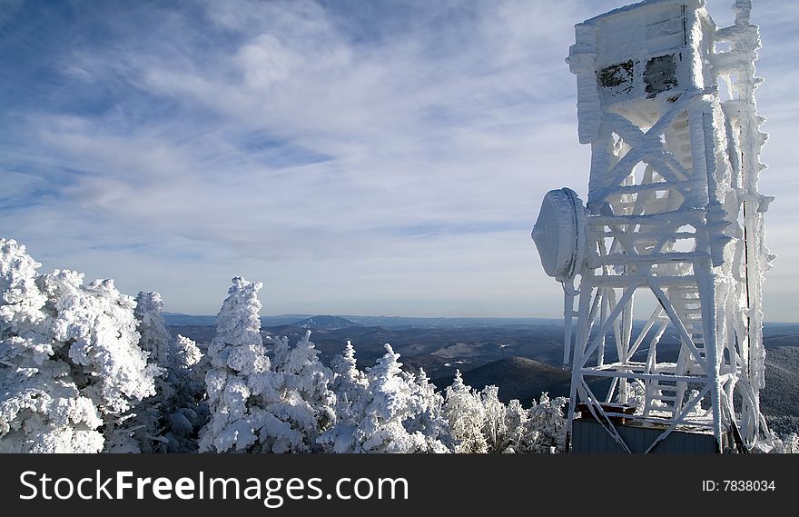 Telecommunications antenna in the mountains during the winter